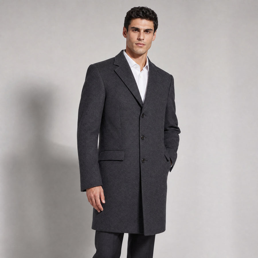 The Broker Men's Tailored Overcoat in Dark Charcoal, worn by model