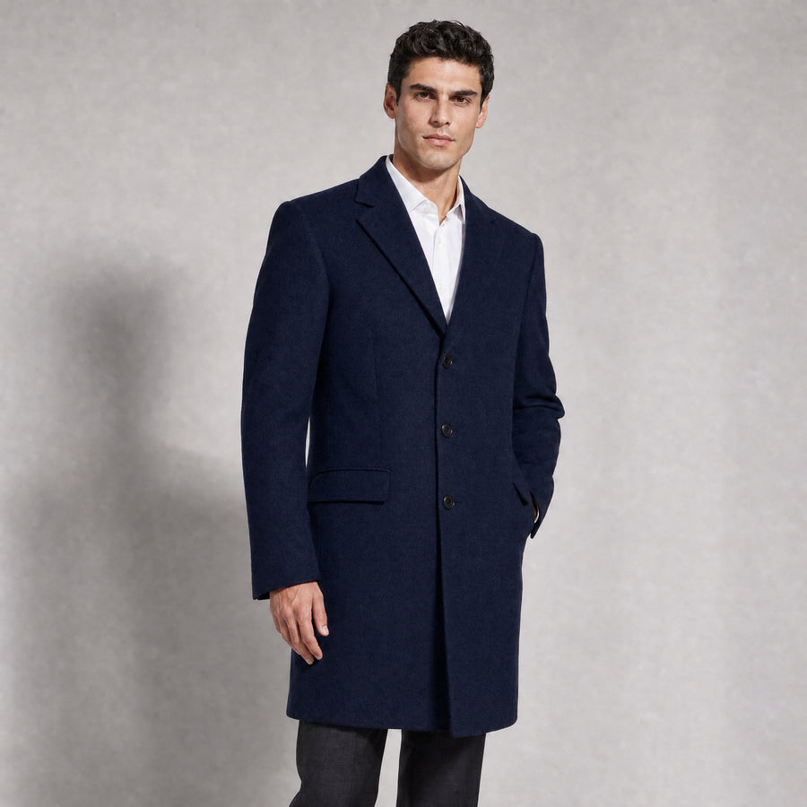 The Broker Men's Tailored Overcoat in Midnight Navy, worn by model