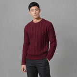 The Cartographer Men's Cable-Knit Crewneck Sweater in Burgundy, worn by model