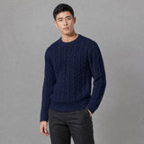 The Cartographer Men's Cable-Knit Crewneck Sweater in Navy Blue, worn by model