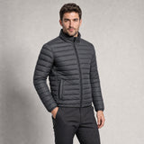 The Draftsman Men's Quilted Puffer Jacket in Graphite, worn by model