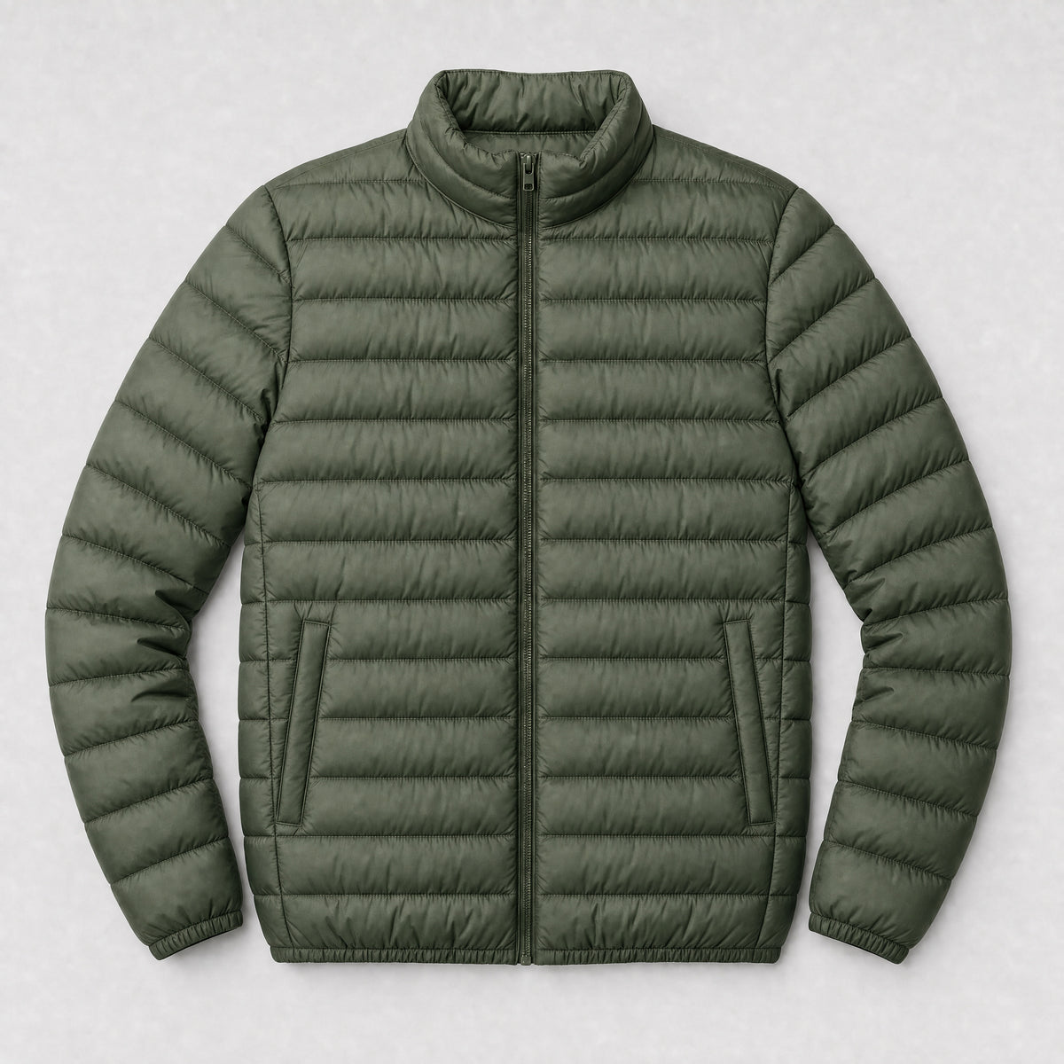 The Draftsman Men's Quilted Puffer Jacket in Moss Green, flat lay
