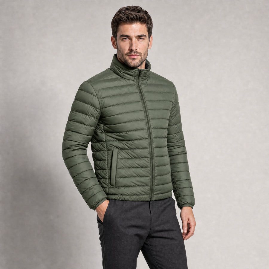 The Draftsman Men's Quilted Puffer Jacket in Moss Green, worn by model