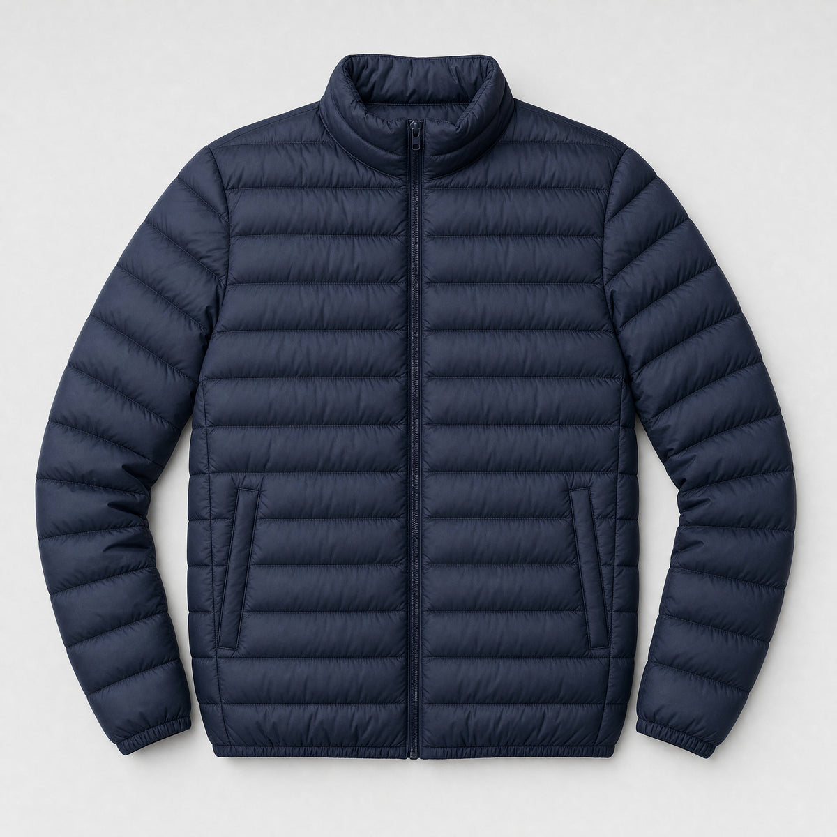 The Draftsman Men's Quilted Puffer Jacket in Ink Navy, flat lay