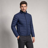 The Draftsman Men's Quilted Puffer Jacket in Ink Navy, worn by model