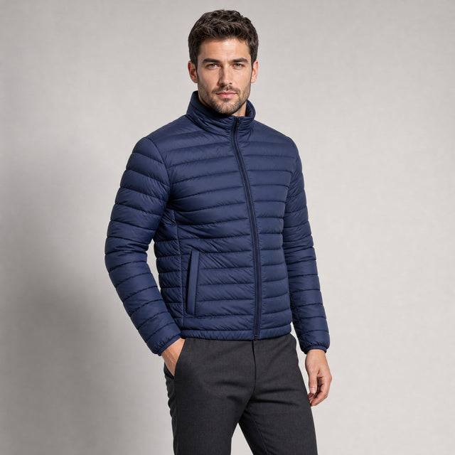 The Draftsman Men's Quilted Puffer Jacket in Ink Navy, worn by model