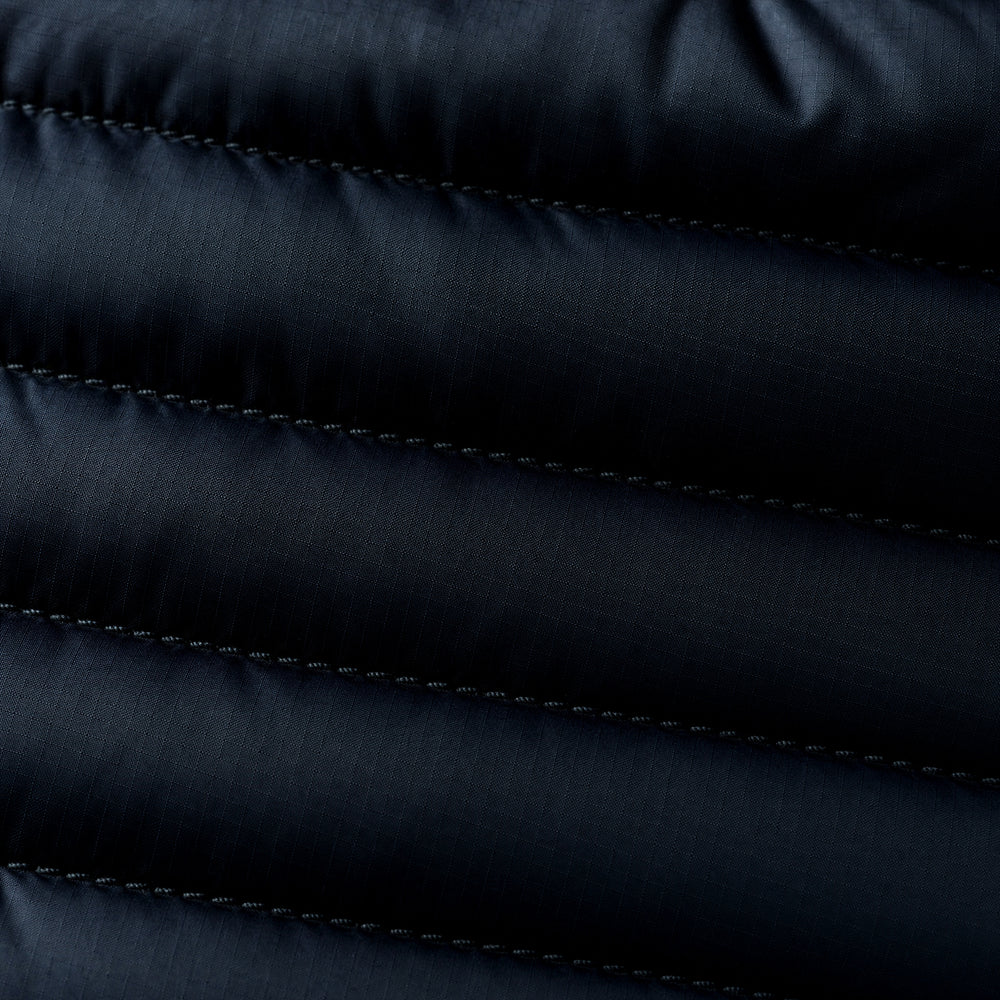 Macro of ink navy quilted stitching