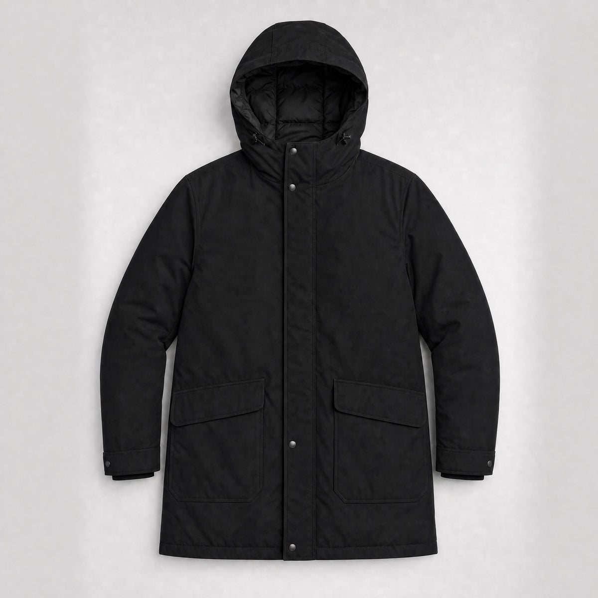 The Editor Men's Hooded Winter Parka in Jet Black, flat lay