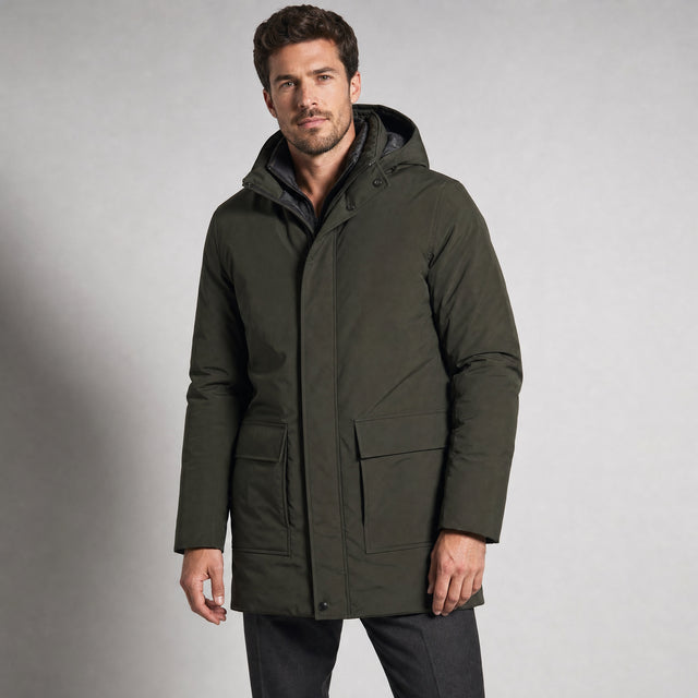 The Editor Men's Hooded Winter Parka in Dark Olive, worn by model