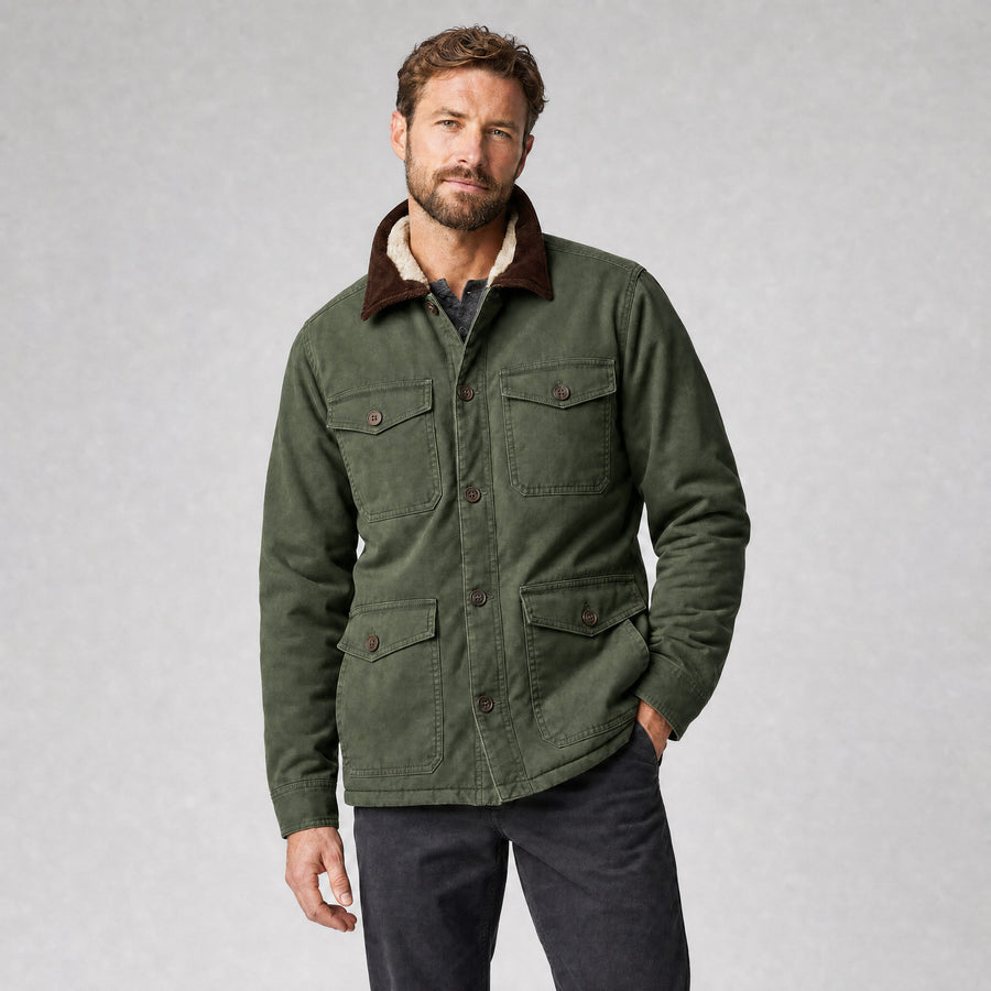 The Foreman Men's Fleece-Lined Canvas Field Jacket in Field Green, worn by model